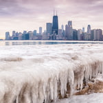 Frozen Lake Michigan and city skyline in Chicago, USA. 